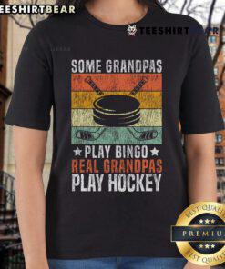 Graphic tee featuring the phrase 'Real Grandpas Play Hockey' for ladies, perfect for hockey-loving grandfathers.