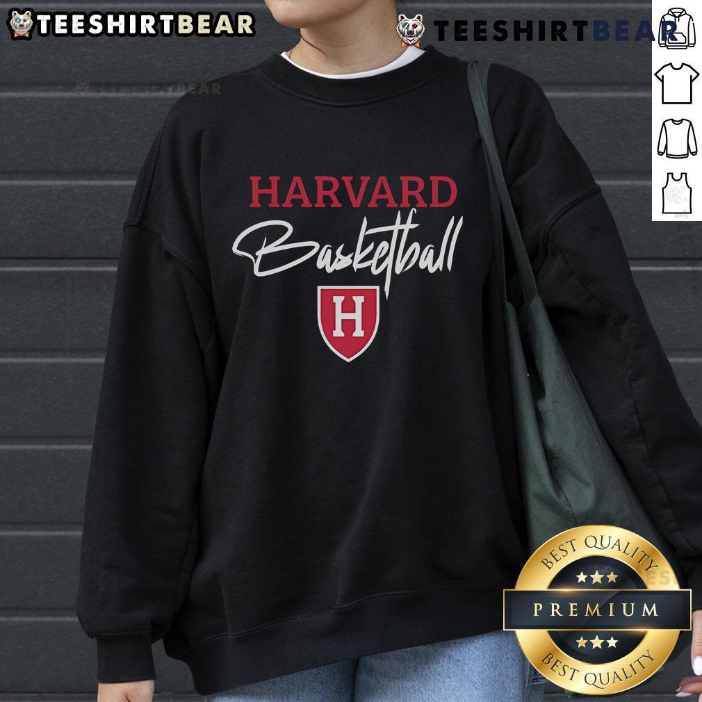 Steve Kerr wearing a Harvard basketball sweatshirt, showcasing his stylish support for the team.