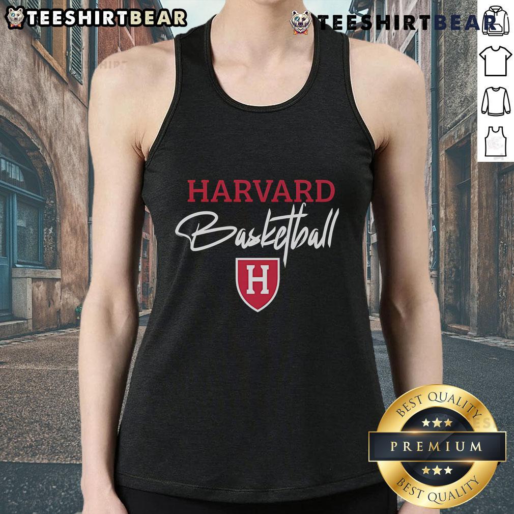 Steve Kerr wearing a Harvard basketball tank top, showcasing his passion for sports and collegiate pride.