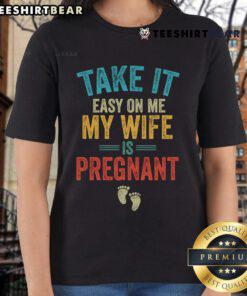 Vintage ladies tee featuring 'Take It Easy On Me, My Wife Is Pregnant' graphic, perfect for expectant moms and casual wear.