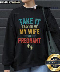 Vintage sweatshirt featuring 'Take It Easy On Me, My Wife Is Pregnant' design, perfect for expecting parents.