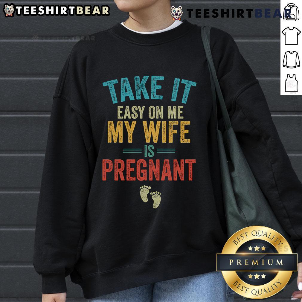 Vintage sweatshirt featuring 'Take It Easy On Me, My Wife Is Pregnant' design, perfect for expecting parents.