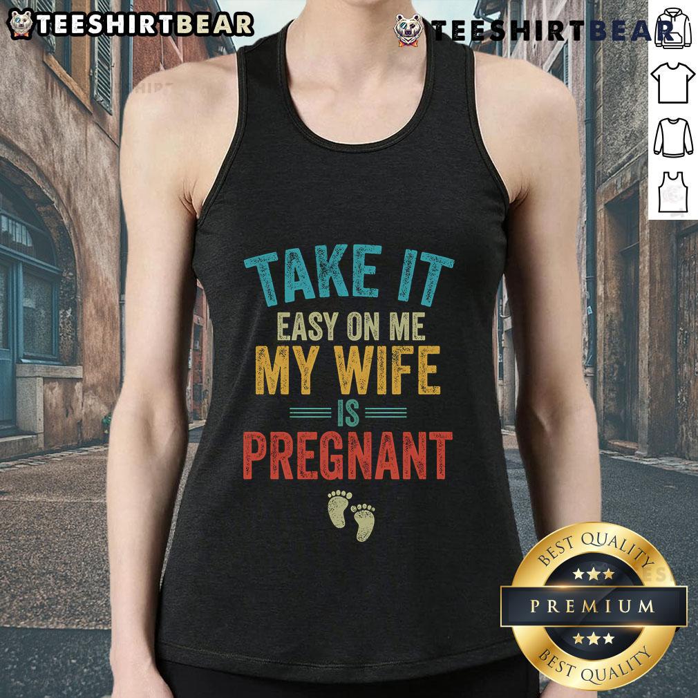 Vintage tank top featuring 'Take It Easy On Me, My Wife Is Pregnant' design, perfect for expecting dads.