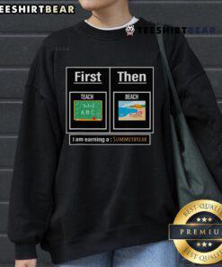 Cozy Top Teacher sweatshirt featuring 'First Teach Then Beach' design, perfect for summer break relaxation.