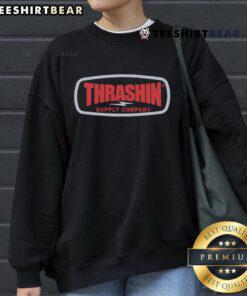 Cozy Top Thrashin Supply Company badge sweatshirt featuring a stylish logo, perfect for casual wear and street style.