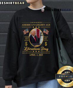 Alt Text: Top Trump reading tariffs on a 'Liberation Day' sweatshirt, celebrating fair trade in a golden age of commerce.