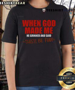 Premium ladies tee featuring the quote 'When God Made Me He Grinned And Said This'll Be Fun' in stylish font.