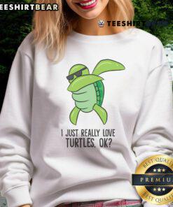 Dabbing turtle sweatshirt featuring a cute turtle graphic and playful text 'I Just Really Love Turtles'.