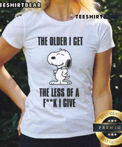 Awesome Snoopy tee for ladies featuring 'The Older I Get, The Less of a F*ck I Give' design, perfect for casual wear.