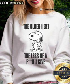 Awesome Snoopy sweatshirt featuring 'The Older I Get, The Less Of A Fck I Give' in a fun design for casual wear.