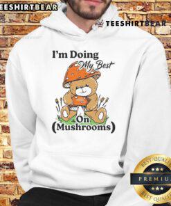 Cute bear teddy wearing a hoodie with mushrooms, showcasing a playful 'I'm doing my best' theme.