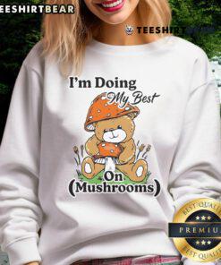 Cute bear teddy in a sweatshirt with 'I'm Doing My Best' slogan, surrounded by colorful mushrooms.