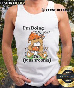 Cute bear teddy wearing a tank top with mushrooms, showcasing a cheerful vibe and a 'I'm doing my best' message.