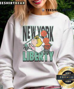 Cute Peanuts Sally x New York Liberty sweatshirt featuring vibrant colors and playful design for stylish fans.