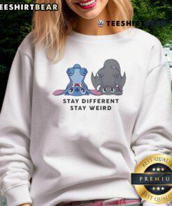 Alt Text: Cute Stitch and Toothless design on a sweatshirt with Stay Different, Stay Weird slogan, perfect for unique style.