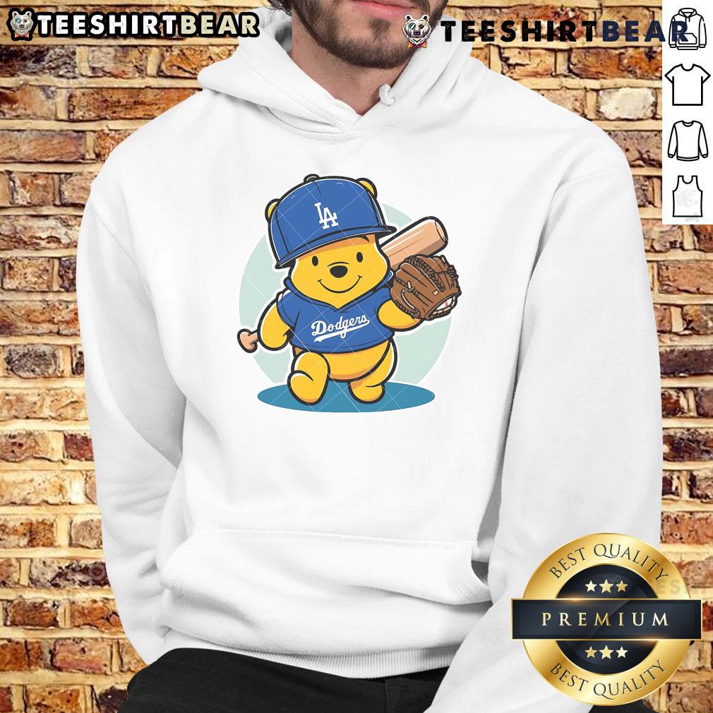 Alt Text: Cute Winnie the Pooh wearing a LA Dodgers baseball hoodie, perfect for fans of Disney and MLB apparel.