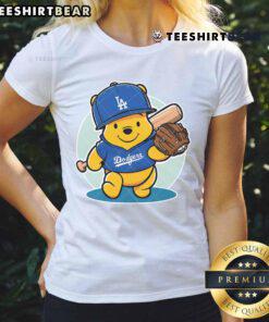 Cute Winnie the Pooh LA Dodgers baseball ladies tee featuring playful design and team colors for fans.