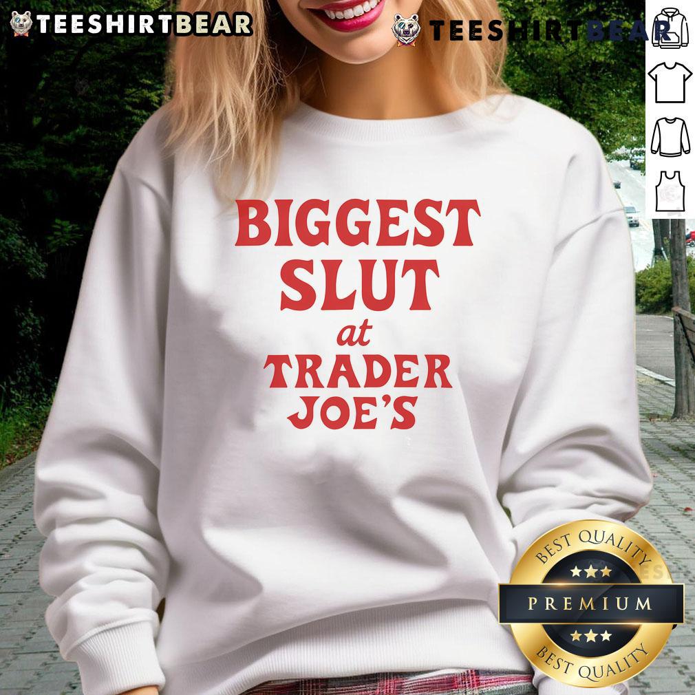 Funny sweatshirt reading 'Biggest Slut At Trader Joe's' displayed in a grocery store setting, perfect for humor lovers.