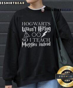 Good Hogwarts Wasn't Hiring So I Teach Muggles Sweatshirt design featuring whimsical text and magical elements.