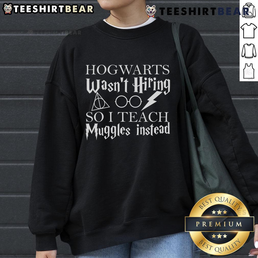 Good Hogwarts Wasn't Hiring So I Teach Muggles Sweatshirt design featuring whimsical text and magical elements.