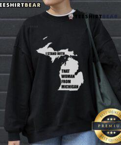 Good I Stand With That Woman From Michigan sweatshirt displayed on a hanger, showcasing its vibrant design and colors.