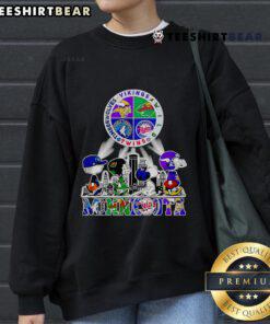 Cozy Good Snoopy sweatshirt featuring Minnesota Twins, Vikings, Wild, and Timberwolves logos, perfect for sports fans.