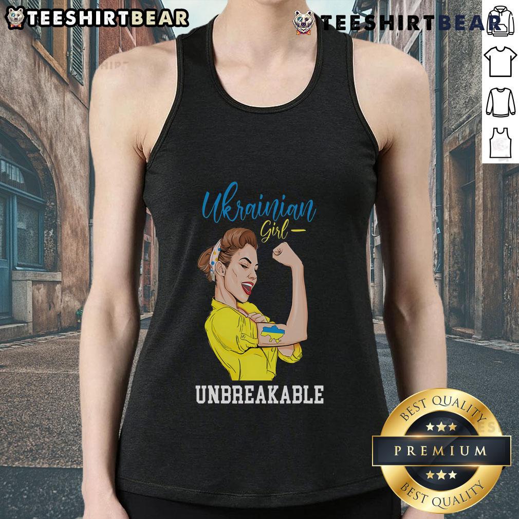 Ukrainian girl in a messy bun wearing a tank top with the Ukraine flag, celebrating her heritage and culture.
