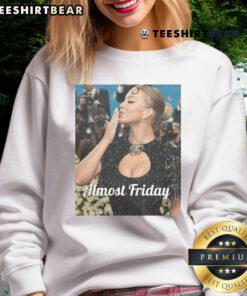 Sydney Sweeney at Met Gala in an 'Almost Friday' sweatshirt, showcasing her unique style and bold fashion choice.