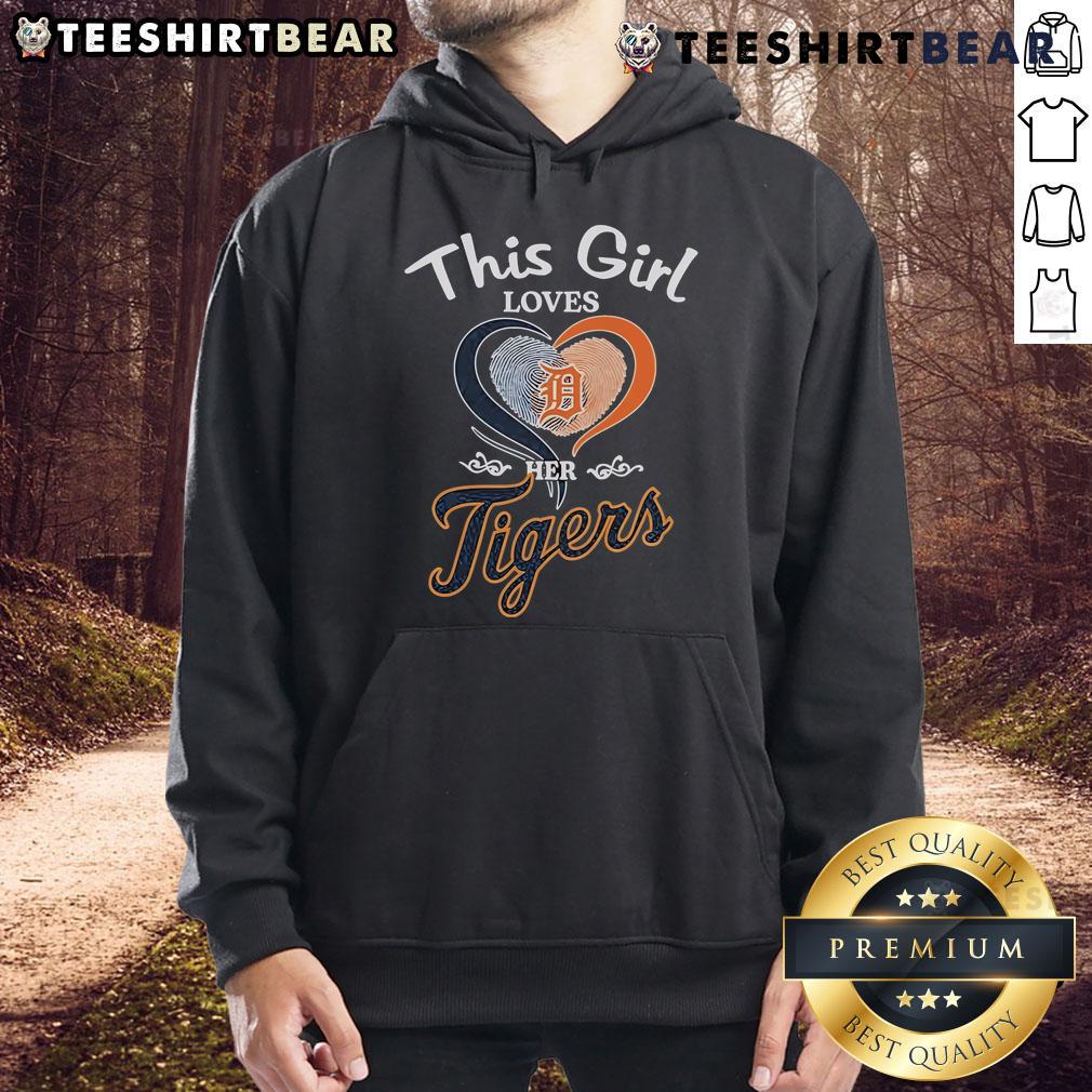 Girl wearing a Detroit Tigers hoodie with a heart fingerprint design, showcasing her love for the team.