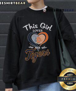Girl wearing a Detroit Tigers sweatshirt with a heart fingerprint design, showcasing her love for the team.