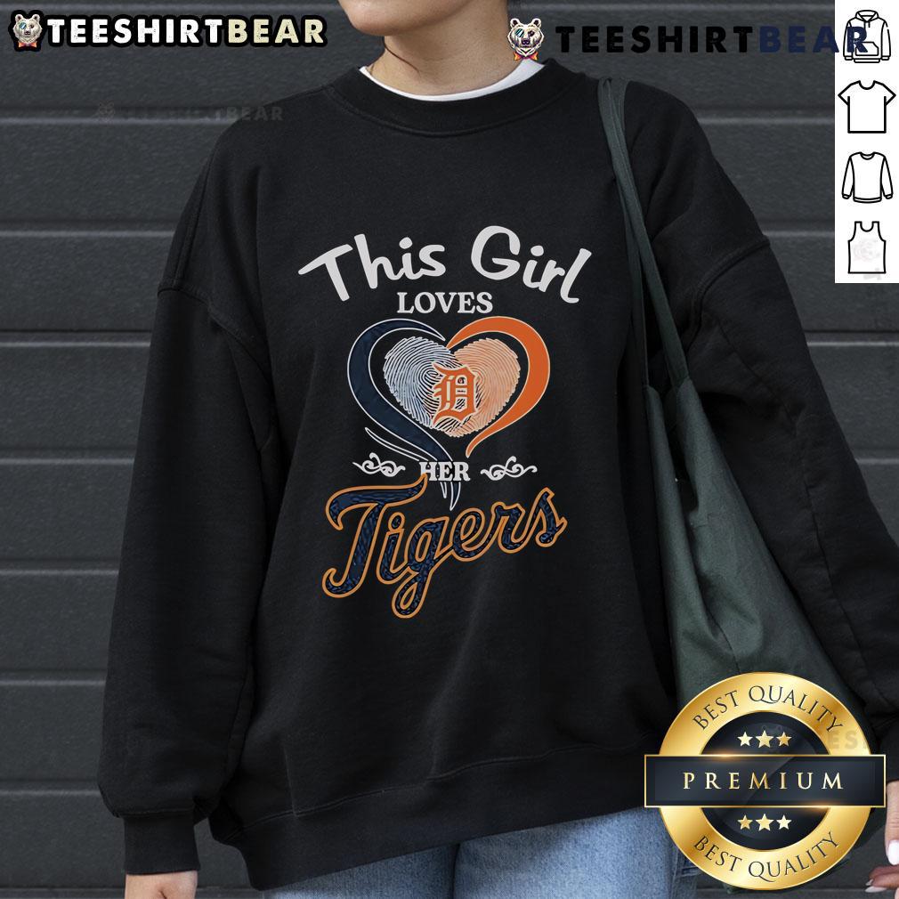 Girl wearing a Detroit Tigers sweatshirt with a heart fingerprint design, showcasing her love for the team.