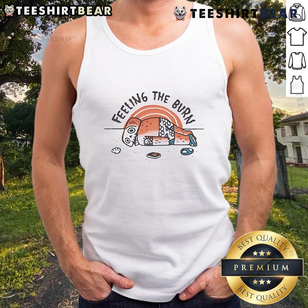 Person wearing a tank top with 'Nice Feeling the Burn' at the beach, showcasing sunburn and summer vibes.
