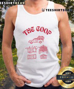 Stylish goth babe wearing The Coop tank top, showcasing edgy fashion and unique style in a vibrant outdoor setting.