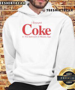 Relaxing in a hoodie, enjoying a Coke in the bathroom, capturing a casual moment of comfort and fun.