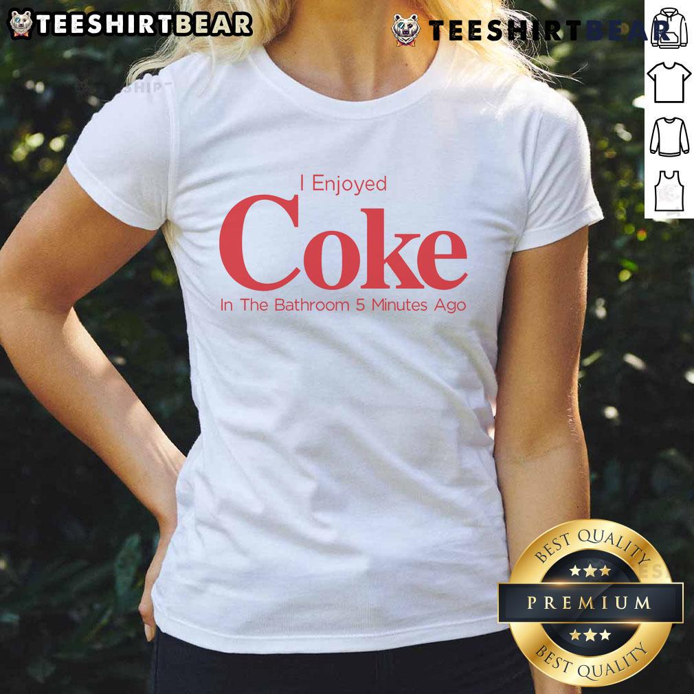 Lady enjoying a refreshing Coke in the bathroom, wearing a stylish tee, captured 5 minutes ago.
