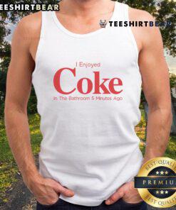 Person in a tank top enjoying a Coke in the bathroom, capturing a relaxed moment from 5 minutes ago.