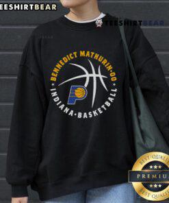 Alt Text: Top Bennedict Mathurin in Indiana Pacers sweatshirt holding a basketball, showcasing his athletic style and team spirit.