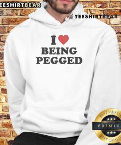 Alt Text: Top I Love Being Pegged Hoodie - trendy graphic sweatshirt showcasing playful humor and bold style for casual wear.
