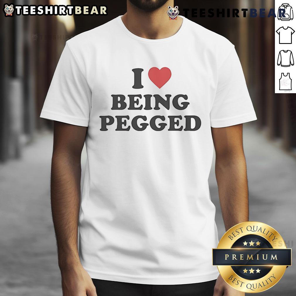 Top I Love Being Pegged T-Shirt featuring a playful design, perfect for expressing fun and confidence in style.