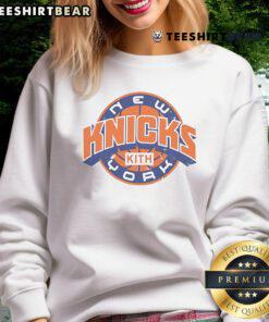 Stylish Top Kith sweatshirt for New York Knicks NBA Playoffs 2025, featuring bold team colors and logo design.