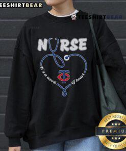 Cozy Minnesota Twins sweatshirt featuring 'It's a Work of Heart' design, perfect for fans and nurses alike.