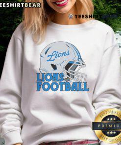 Alt Text: Top NFL Detroit Lions football helmet sweatshirt featuring team colors and logo for fans and sports enthusiasts.