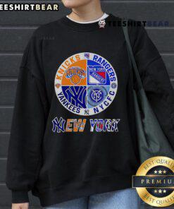 Alt Text: Top New York Yankees, Knicks, Rangers, and NYCFC logo sweatshirt featuring a stylish sports circle design.