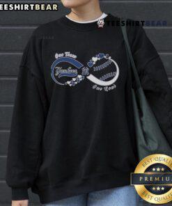 Alt Text: Top New York Yankees sweatshirt featuring 'One Team. One Goal. One Love.' slogan in stylish design.