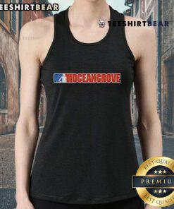 Top Ocean Grove Nu Metal Tank Top displayed on a model against a vibrant urban backdrop, showcasing trendy streetwear style.