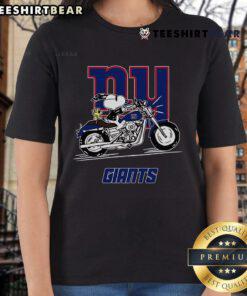 Snoopy and Woodstock riding a motorbike on a New York Giants ladies tee, showcasing a fun and vibrant design.