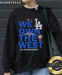 Alt Text: Top We Own The West Dodger Champions West Division Sweatshirt in blue, celebrating Dodgers' victory.