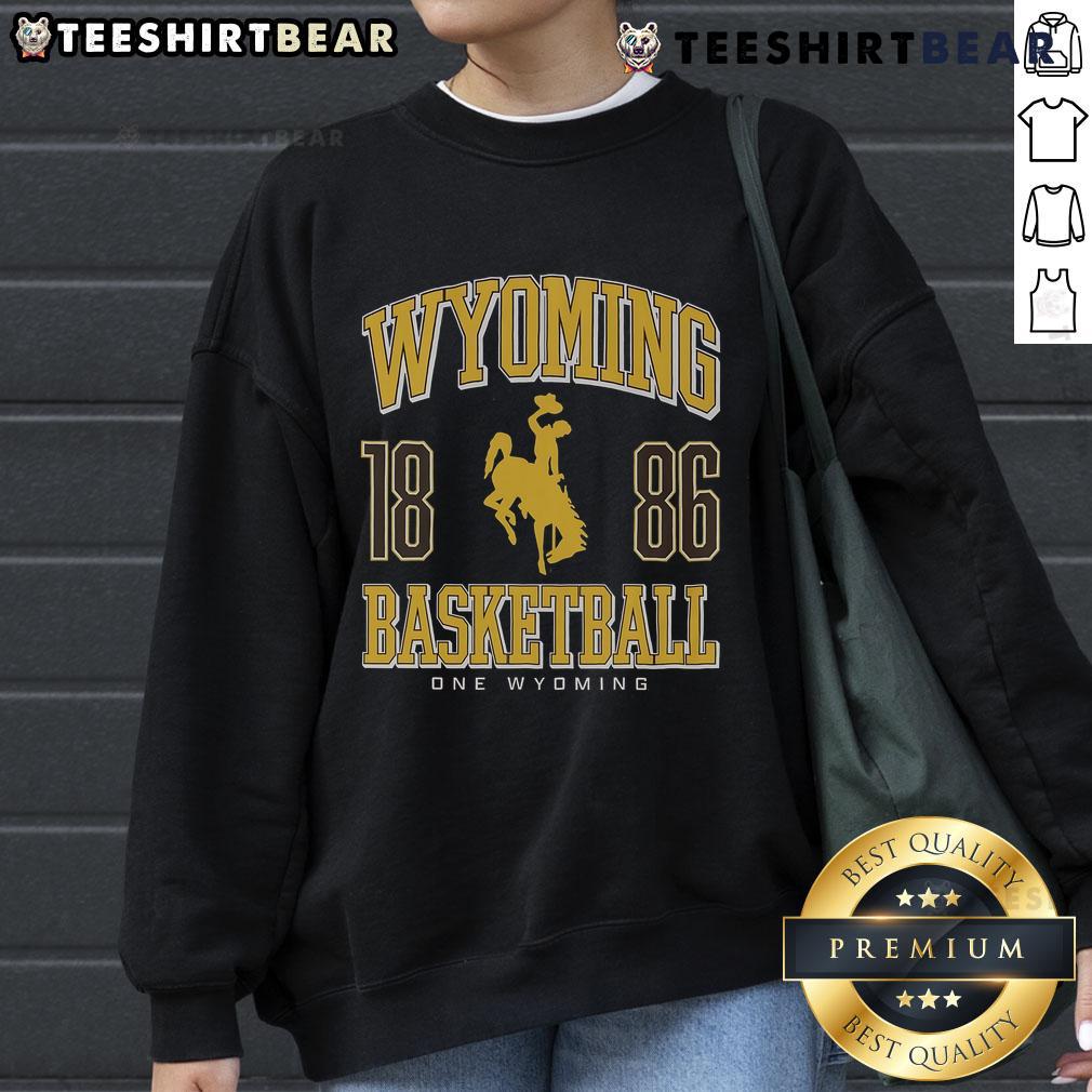 Cozy Top Wyoming Cowboys Basketball 1886 sweatshirt featuring team colors and logo, perfect for fans and casual wear.
