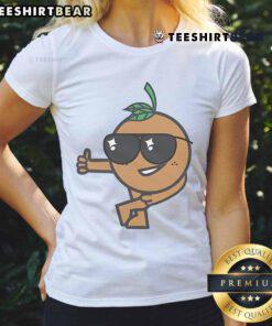 CSUF Advertising Club members giving thumbs up in stylish tee, promoting teamwork and creativity in advertising.