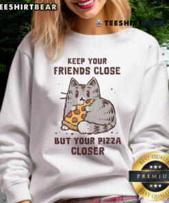 Cute cat sweatshirt with 'Keep Your Friends Close But Your Pizza Closer' slogan, perfect for cat lovers and pizza fans.